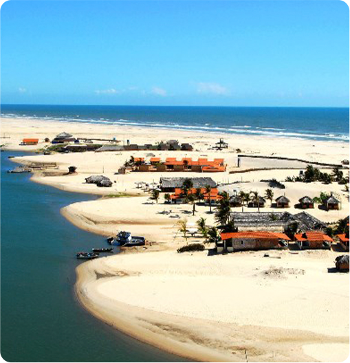 paisagem de uma lagoa azul em meio a dunas de areia branca